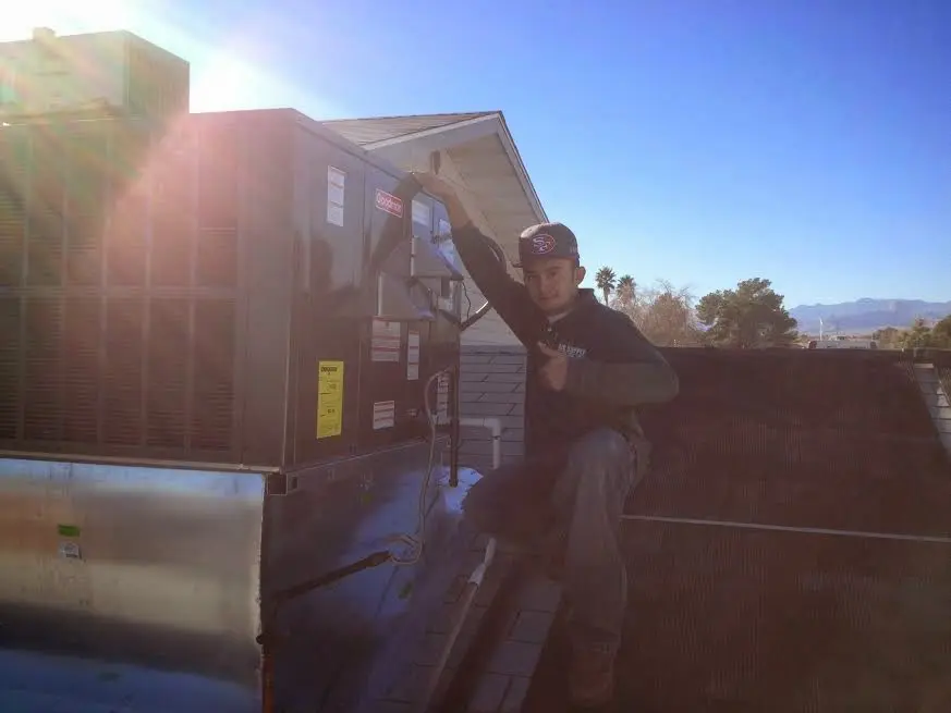 HVAC technician performing Boiler Repair on a rooftop unit in Santa Monica